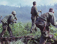 Three infantrymen on patrol in Vietnam