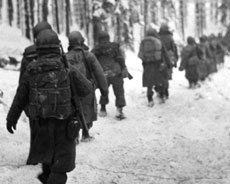 Soldiers during World War II walking in the snow