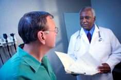 Doctor talking to a male patient