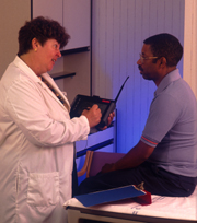 Doctor performs examination on veteran patient.