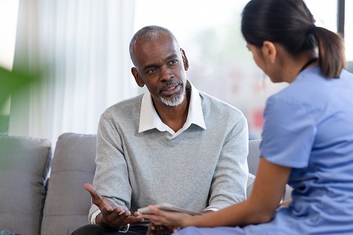 Doctor speaking with older man 