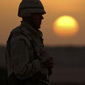Silhouette of soldier and setting sun