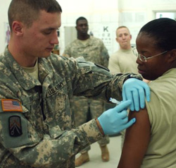 Female Servicemember getting vaccinated