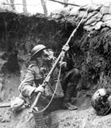 World War I soldier in trench wearing gasmask