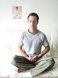 Man in seated yoga pose